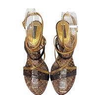 Top view of Louis Vuitton brown Monogram and metallic gold strappy sandals showing open-toe design and ankle straps