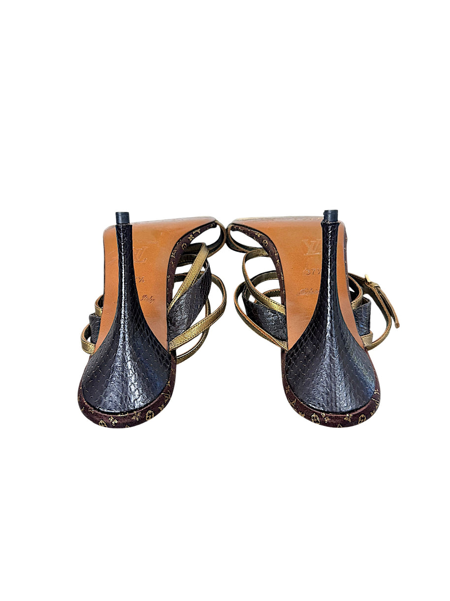 Underside and heel view of Louis Vuitton vintage Monogram sandals showing dark textured stiletto heels and leather soles