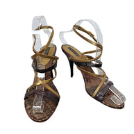 Front view of Louis Vuitton vintage Monogram strappy stiletto sandals in brown and metallic gold