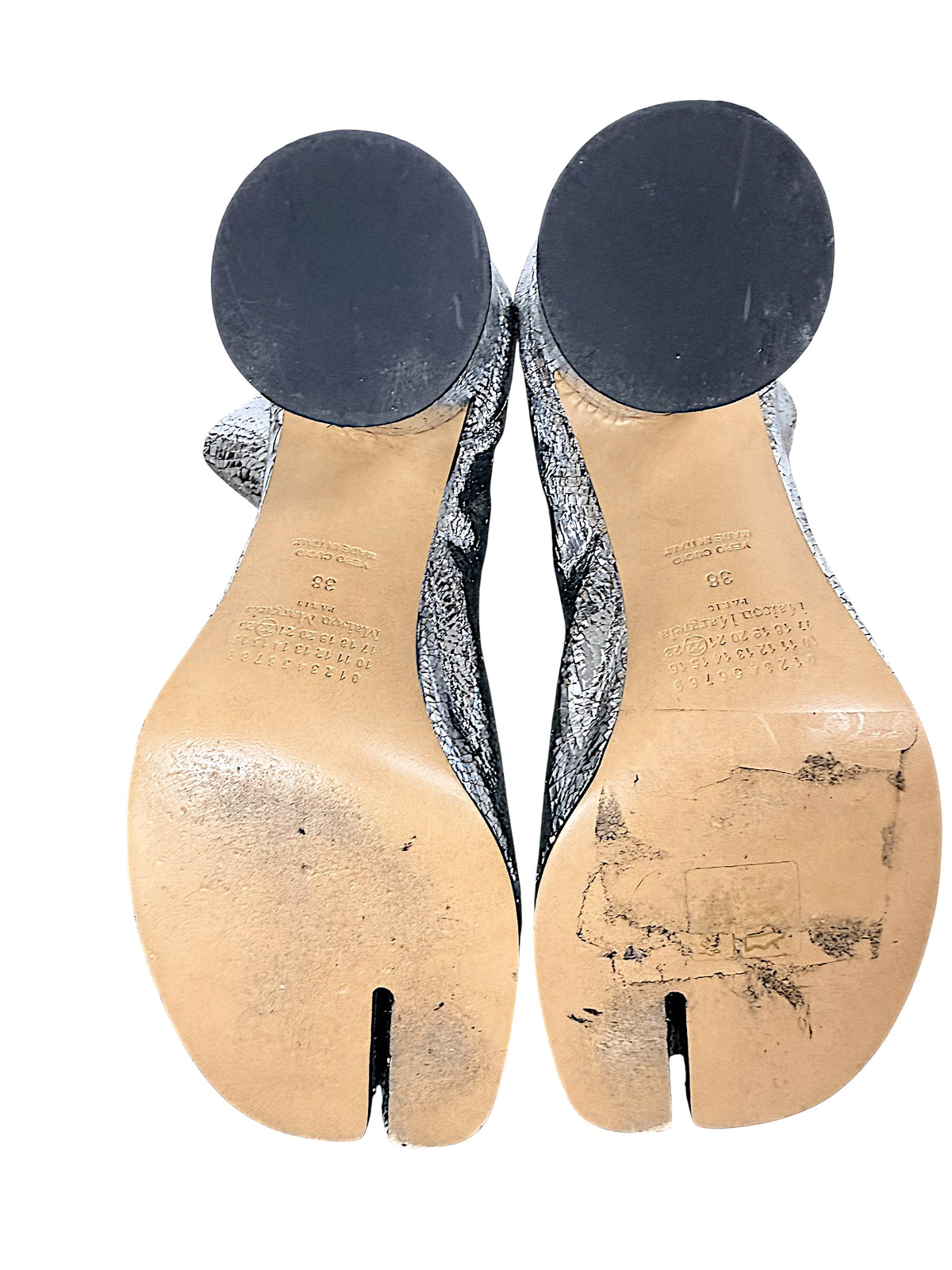 Leather soles of Maison Margiela silver Tabi ankle boots size 38 showing wear consistent with previous use