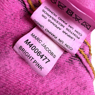 Marc Jacobs Paradise bright pink denim jacket interior care label showing style number M4006477, Bright Pink color designation and garment care instructions.