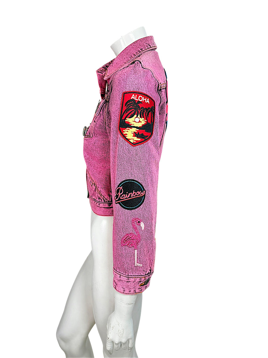 Marc Jacobs Paradise pink denim jacket sleeve with embroidered Aloha tropical patch, Rainbow emblem and pink flamingo design.