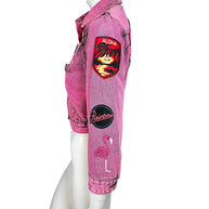 Marc Jacobs Paradise pink denim jacket sleeve with embroidered Aloha tropical patch, Rainbow emblem and pink flamingo design.