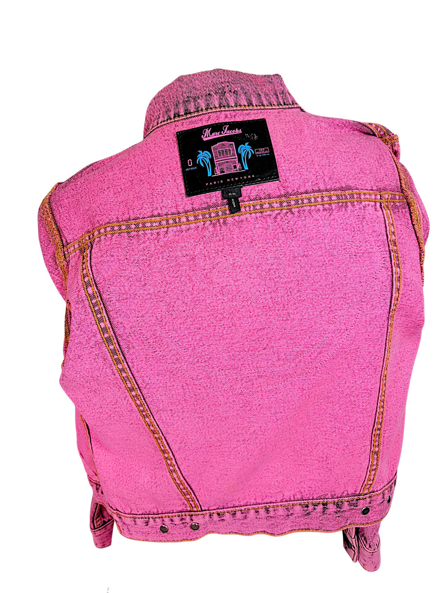 Interior view of Marc Jacobs Paradise pink denim jacket showing black designer label with tropical palm tree graphics and size Medium tag.