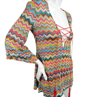 Three-quarter angled view of Missoni Mare multicolor chevron knit resort cover-up dress with flared sleeves and lace-up front.