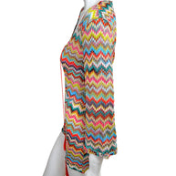 Side profile of Missoni Mare multicolor knit beach cover-up dress with lightweight semi-sheer zigzag fabric and tasseled neckline ties.