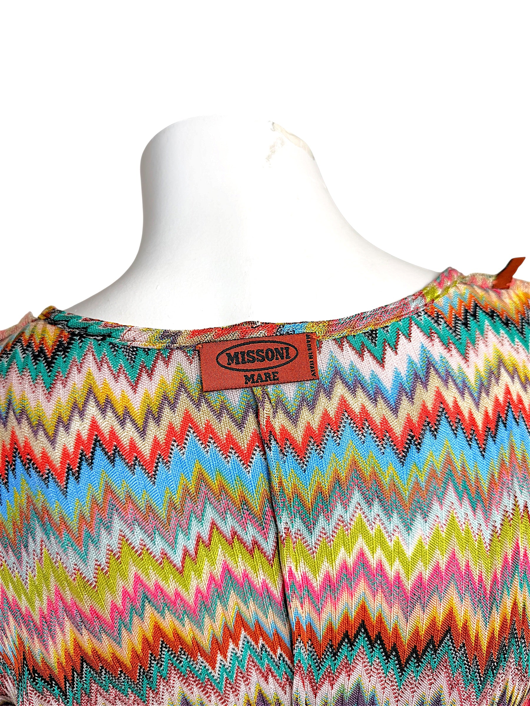 Close-up of authentic Missoni Mare label on multicolor zigzag knit Italian-made resortwear cover-up.