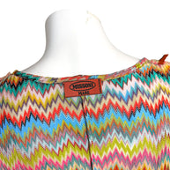 Close-up of authentic Missoni Mare label on multicolor zigzag knit Italian-made resortwear cover-up.