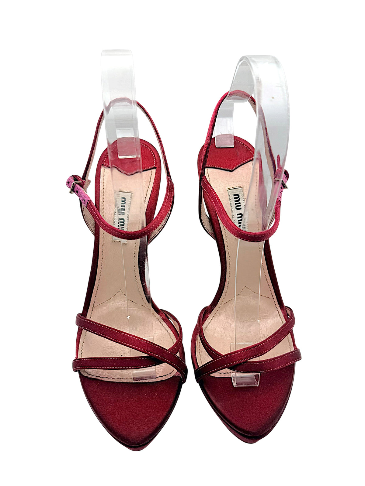 Front view of Miu Miu burgundy satin platform sandals with open toes, crossed satin straps, ankle closures and branded leather insoles.