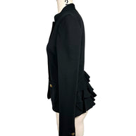 Opposite side view of Moschino black structured jacket displaying its slim fitted waist, stand collar, gold-tone cuff buttons and tiered back ruffles.