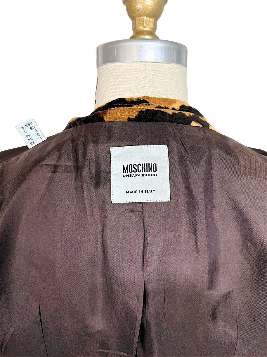 Close-up of authentic Moschino Cheap and Chic Made in Italy designer label inside the tiger-print velvet blazer.