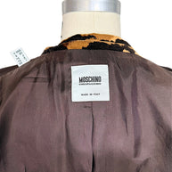 Close-up of authentic Moschino Cheap and Chic Made in Italy designer label inside the tiger-print velvet blazer.