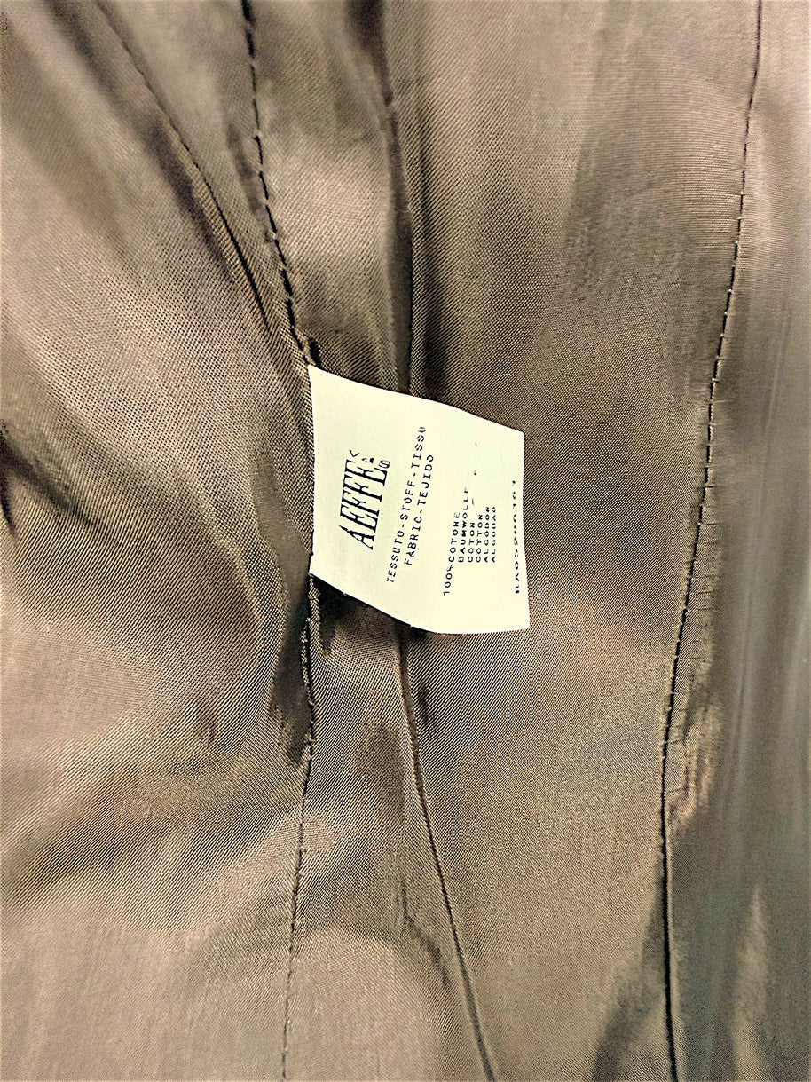 Interior fabric composition label of Moschino Cheap and Chic tiger-print velvet blazer showing 100 percent cotton.