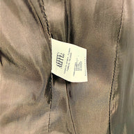 Interior fabric composition label of Moschino Cheap and Chic tiger-print velvet blazer showing 100 percent cotton.