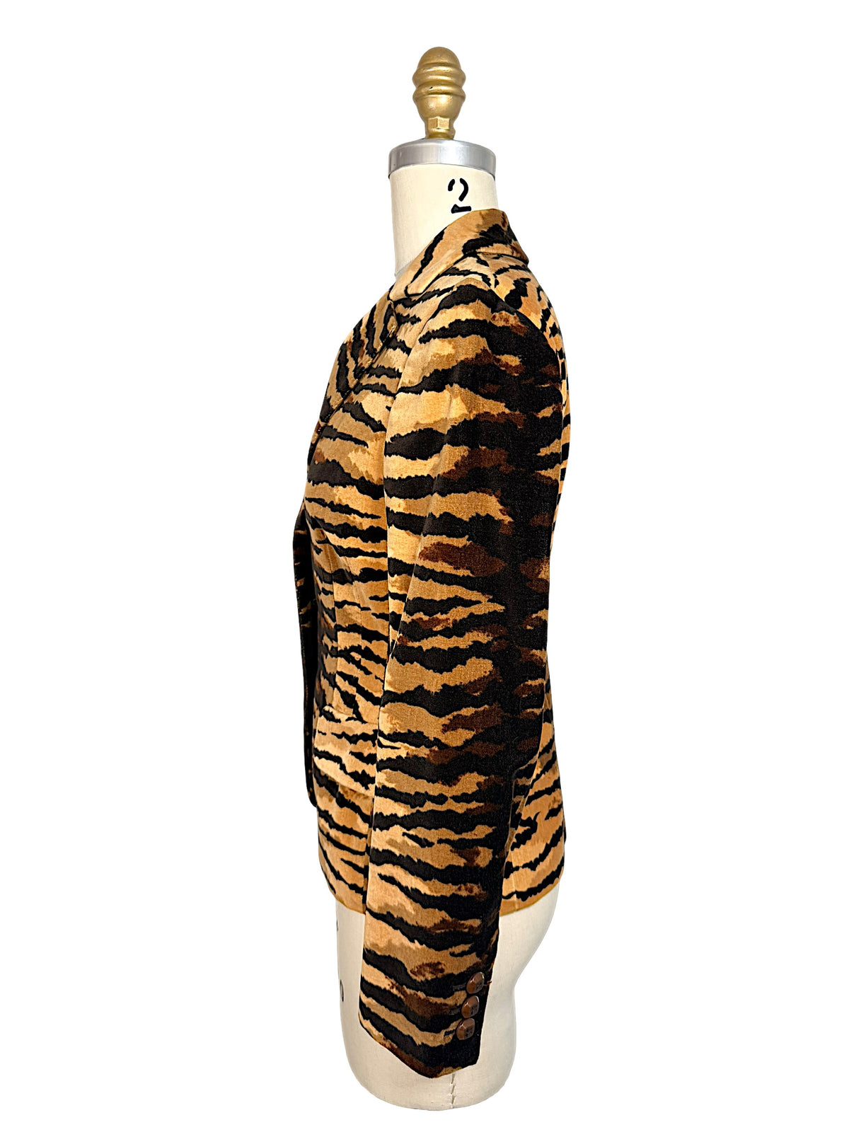 Opposite side profile of Moschino Cheap and Chic tiger-print velvet jacket highlighting the fitted silhouette and sleeve buttons.