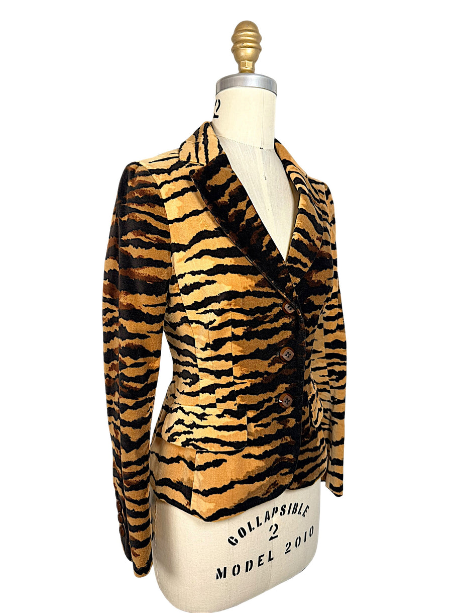 Three-quarter front view of Moschino Cheap and Chic tiger-print velvet jacket showing structured shoulders and tailored waist.