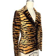 Three-quarter front view of Moschino Cheap and Chic tiger-print velvet jacket showing structured shoulders and tailored waist.