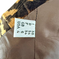 Moschino Cheap and Chic blazer size label showing Italian 38, French 34, UK 6 and US 4 sizing.