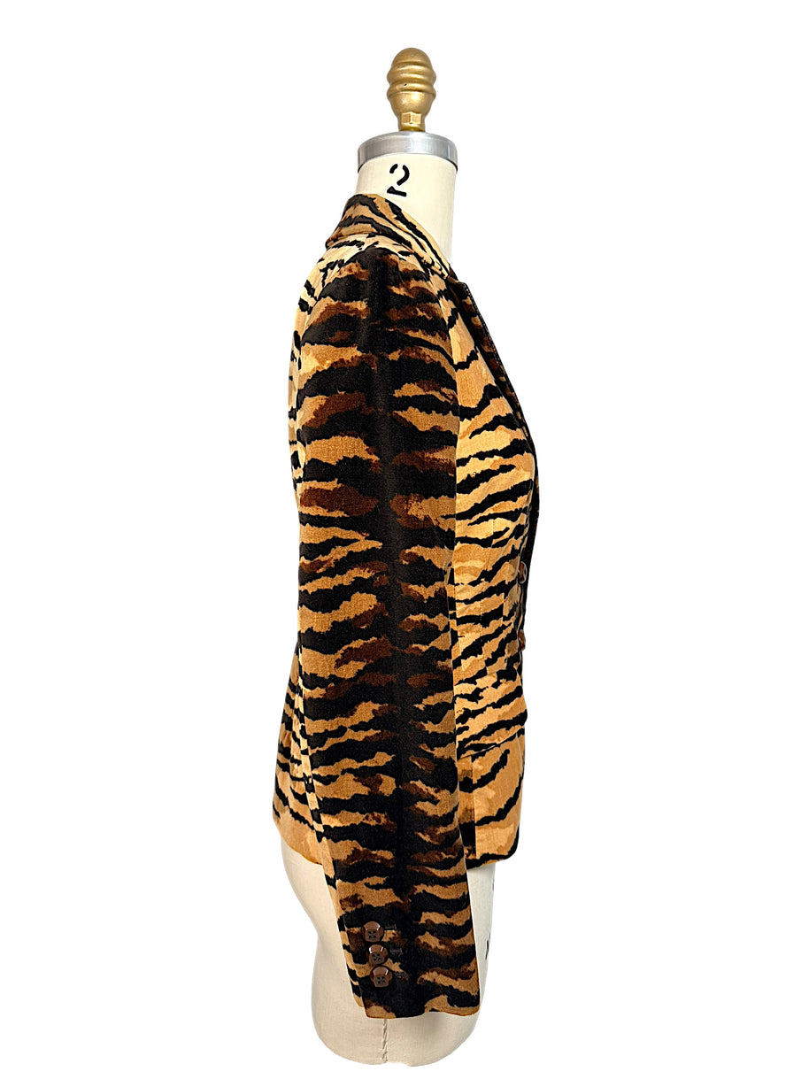 Side profile of Moschino Cheap and Chic brown and black tiger-striped velvet blazer with long sleeves and buttoned cuff.