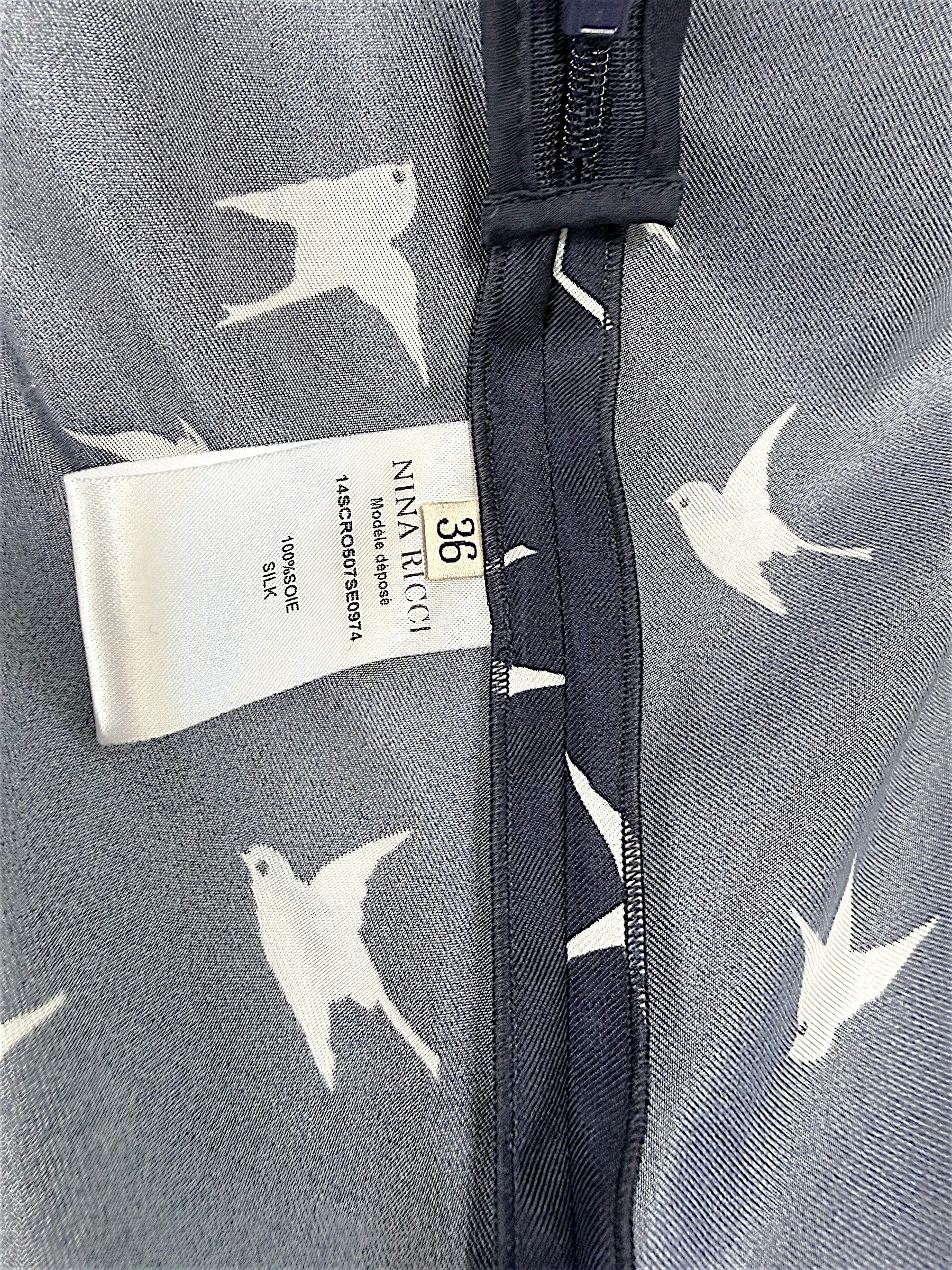 Nina Ricci size FR 36 and 100 percent silk composition tag detail inside designer dress.