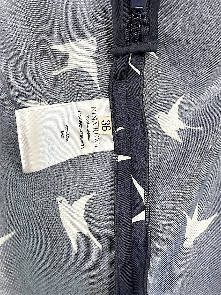 Nina Ricci size FR 36 and 100 percent silk composition tag detail inside designer dress.