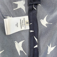 Nina Ricci size FR 36 and 100 percent silk composition tag detail inside designer dress.