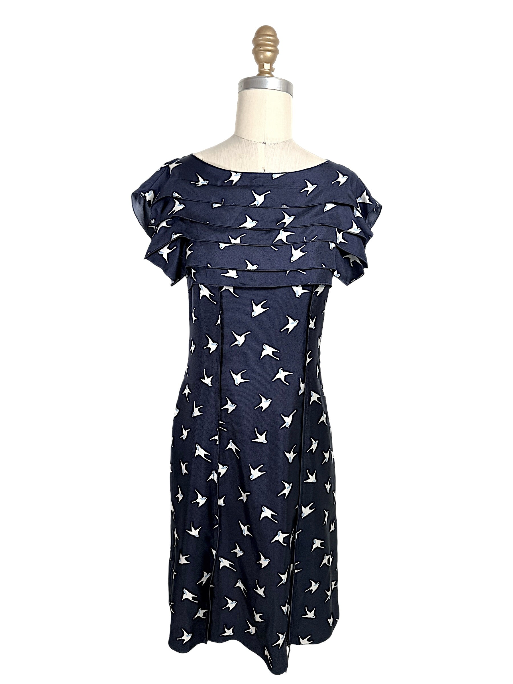 Nina Ricci navy silk dress with ivory swallow bird print and layered ruffle bodice detail, front full view, size FR 36.