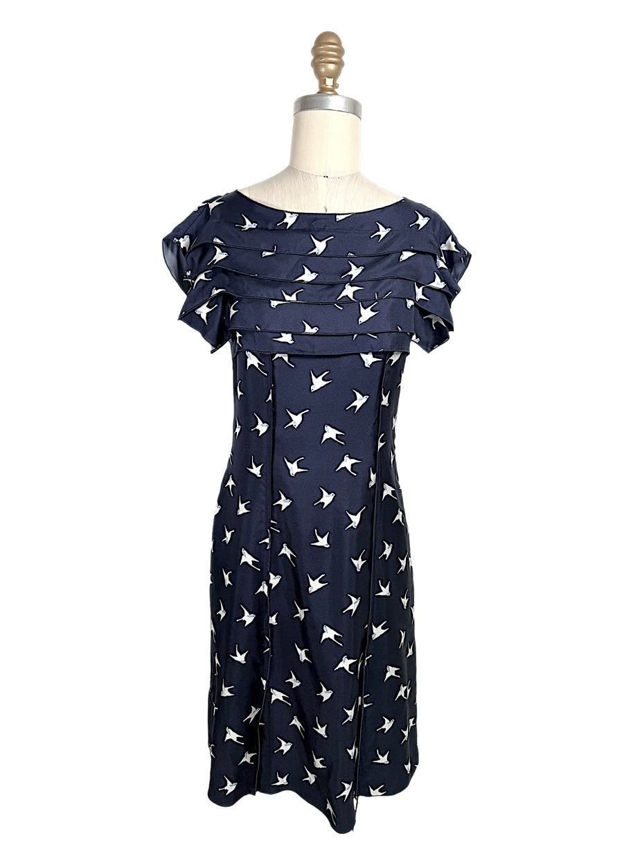 Nina Ricci navy silk dress with ivory swallow bird print and layered ruffle bodice detail, front full view, size FR 36.
