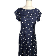 Nina Ricci navy silk dress with ivory swallow bird print and layered ruffle bodice detail, front full view, size FR 36.