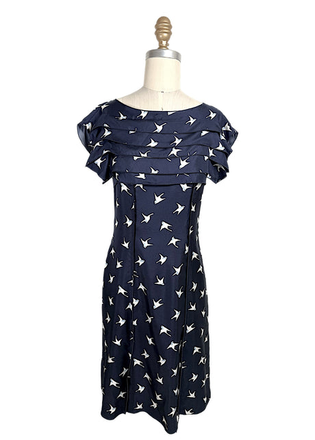 Nina Ricci navy silk dress with ivory swallow bird print and layered ruffle bodice detail, front full view, size FR 36.
