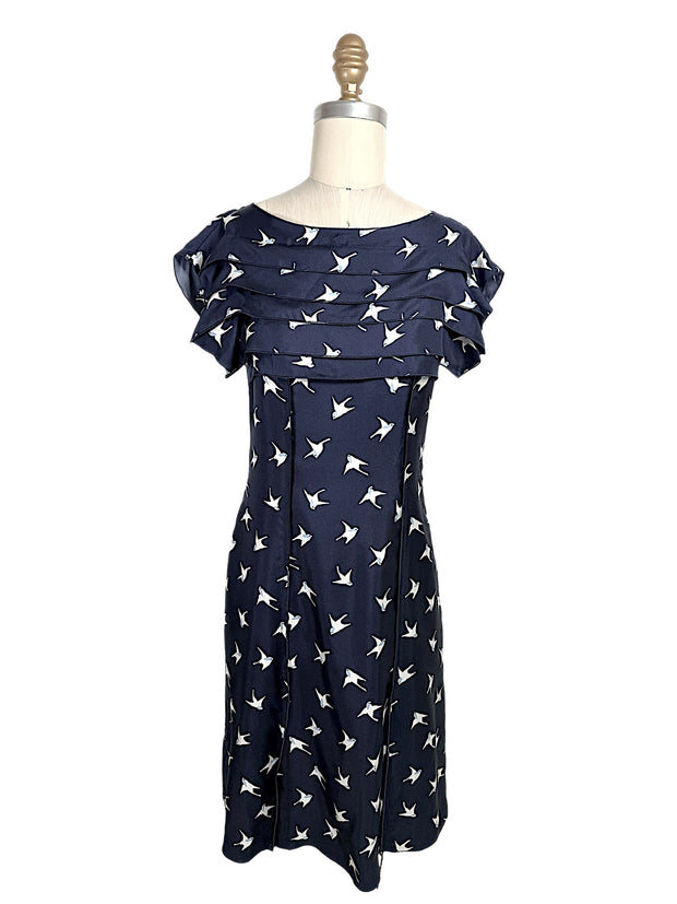 Nina Ricci navy silk dress with ivory swallow bird print and layered ruffle bodice detail, front full view, size FR 36.