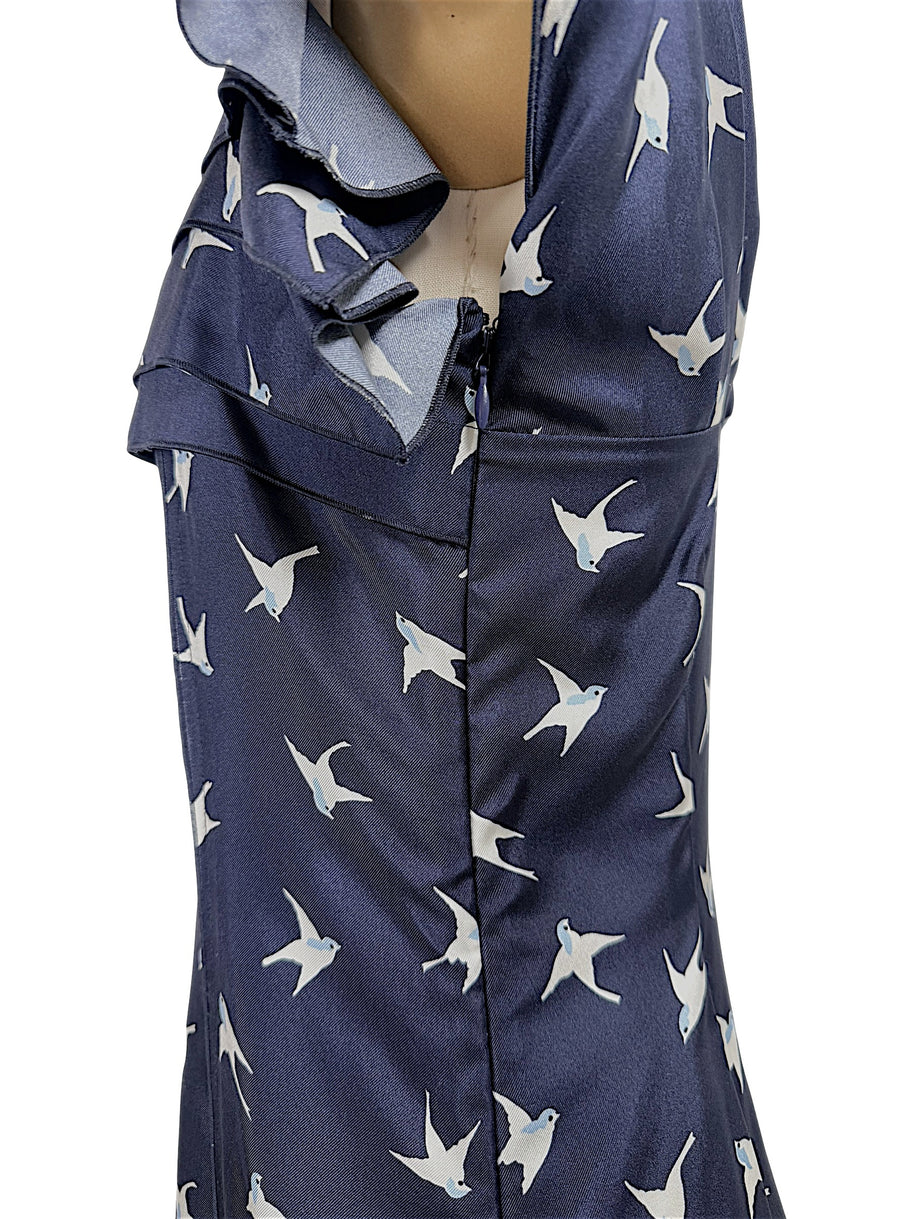 Close-up detail of concealed side zipper and silk swallow bird print fabric on Nina Ricci designer dress.