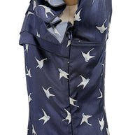 Close-up detail of concealed side zipper and silk swallow bird print fabric on Nina Ricci designer dress.