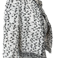 Oscar de la Renta tweed jacket fabric detail close-up black white woven texture fringe trim