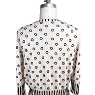 Back view of Oscar de la Renta ivory sweater with black beaded polka dot embellishment throughout