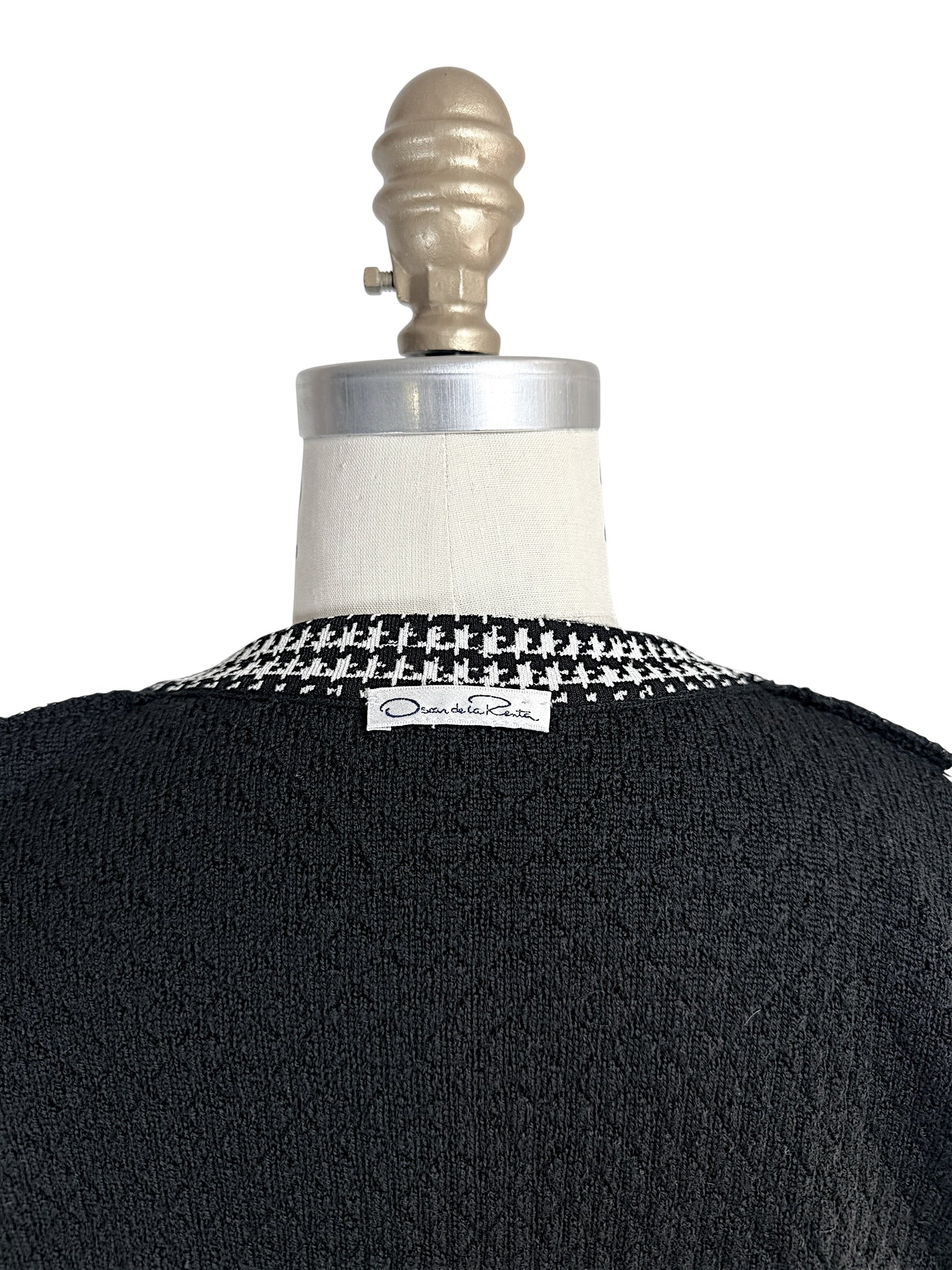 Oscar de la Renta designer label detail on back neckline of black textured knit cardigan