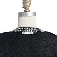 Oscar de la Renta designer label detail on back neckline of black textured knit cardigan