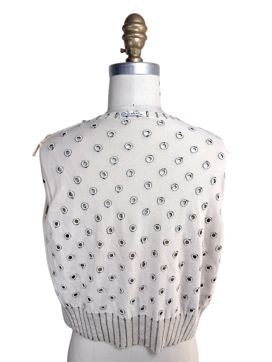 Interior back view of Oscar de la Renta ivory cardigan showing reverse side of embroidered polka dot detailing