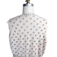 Interior back view of Oscar de la Renta ivory cardigan showing reverse side of embroidered polka dot detailing