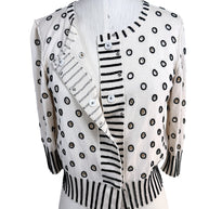 Oscar de la Renta ivory beaded cardigan shown partially open displaying concealed button front closure
