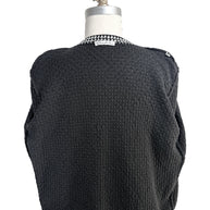 Full back view of Oscar de la Renta textured black wool cardigan on mannequin