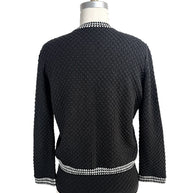 Back view of Oscar de la Renta black textured wool cardigan with houndstooth trim hem and collar