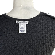 Back detail of Oscar de la Renta black textured knit shell showing designer label and textured knit fabric