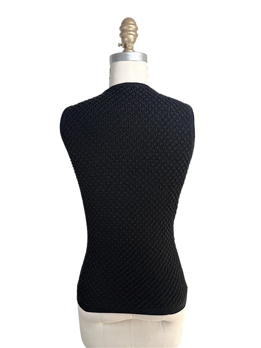 Back view of Oscar de la Renta textured black wool knit shell top on mannequin