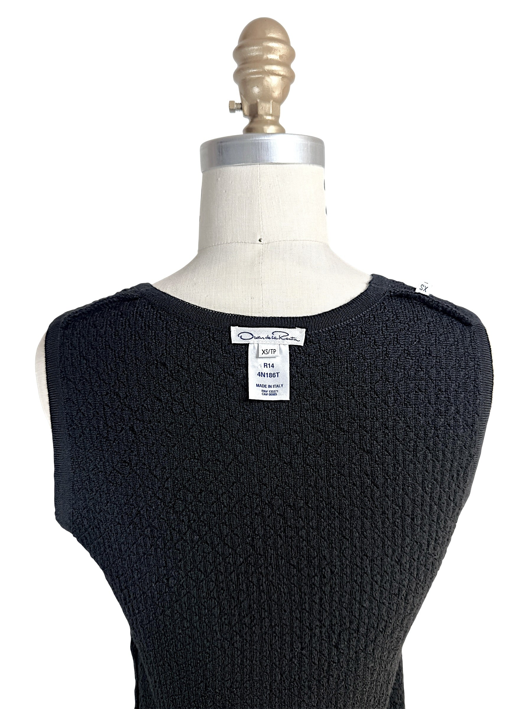 Oscar de la Renta knit shell interior label showing XS size and Made in Italy tag