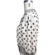 Left side profile of Oscar de la Renta ivory cropped cardigan with black beaded polka dot embroidery