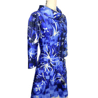 Three-quarter front view of the Oscar de la Renta Pre-Fall 2014 abstract blue dress highlighting the tailored silhouette, sculptural collar, and front patch pocket.
