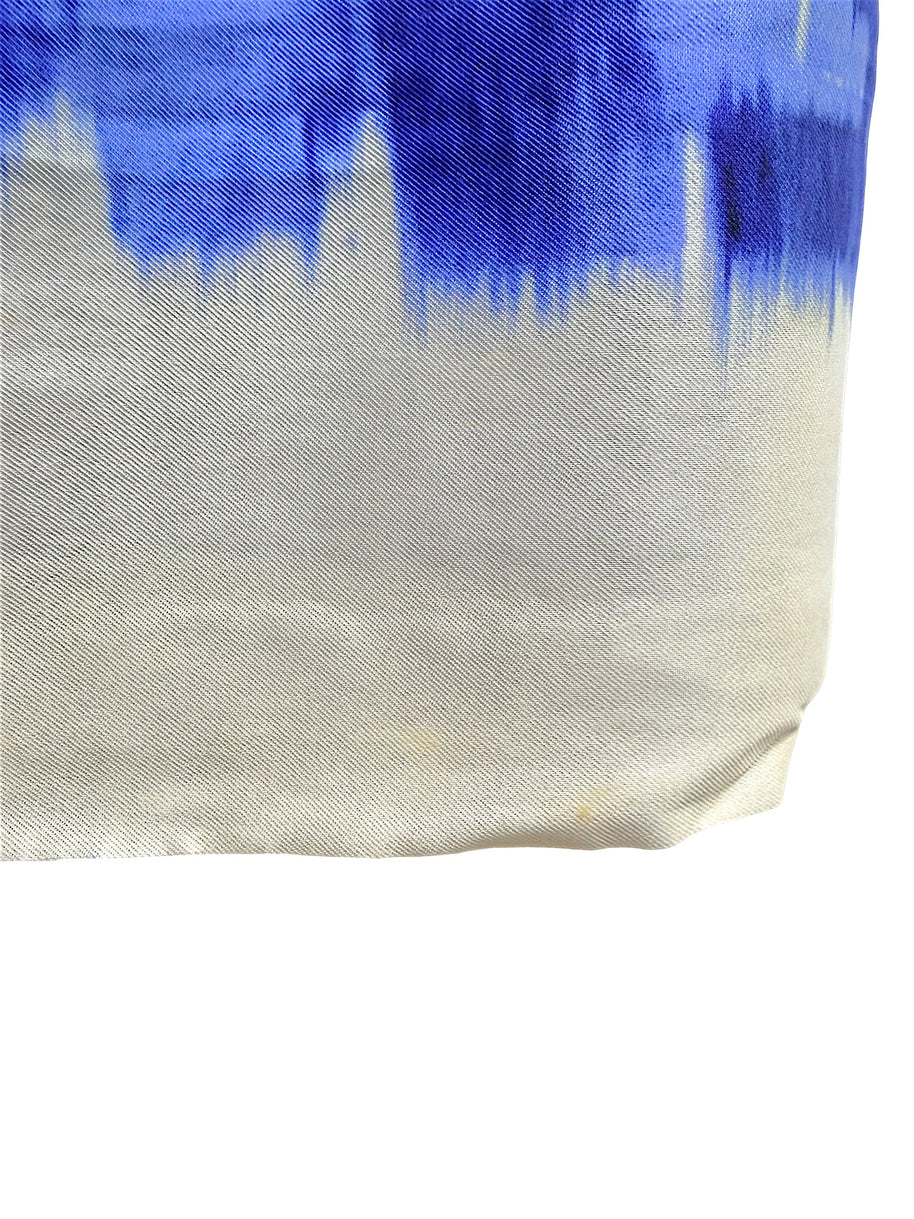 Close-up condition detail of the Oscar de la Renta Pre-Fall 2014 dress showing light areas of soiling near the ivory hem as photographed.