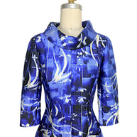 Close-up of the Oscar de la Renta Pre-Fall 2014 dress showcasing the sculptural portrait collar, architectural tailoring, and painterly blue abstract print.