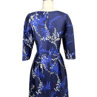 Back view of Oscar de la Renta Pre-Fall 2017 navy cocktail dress featuring structured silhouette and laurel print